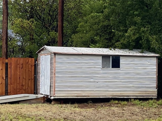 view of shed with fence