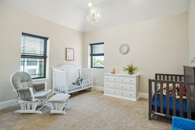 bedroom with vaulted ceiling, an inviting chandelier, light carpet, and a crib