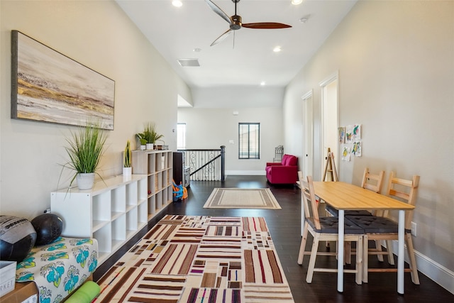 interior space featuring dark wood-type flooring and ceiling fan