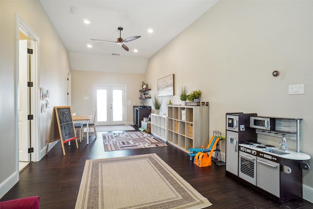 game room featuring french doors, lofted ceiling, dark hardwood / wood-style flooring, and ceiling fan