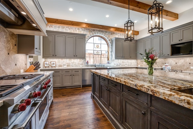 kitchen with dark hardwood / wood-style flooring, backsplash, appliances with stainless steel finishes, premium range hood, and beam ceiling