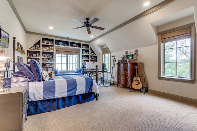 carpeted bedroom with ceiling fan, ornamental molding, and vaulted ceiling