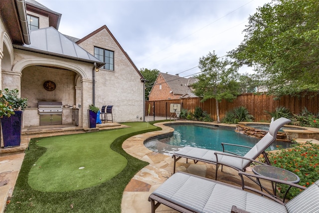 view of swimming pool with area for grilling and a patio area