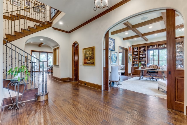 foyer entrance featuring hardwood / wood-style floors, coffered ceiling, crown molding, and beamed ceiling