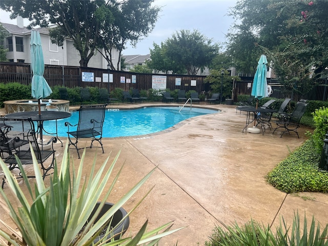 view of swimming pool featuring a patio