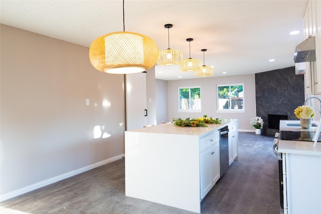 kitchen featuring white cabinetry, light countertops, ventilation hood, and wood finished floors