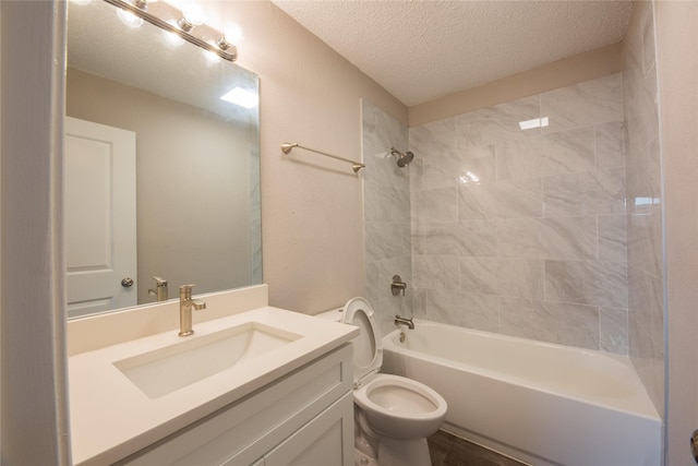 full bath with a textured ceiling, a textured wall, bathtub / shower combination, toilet, and vanity