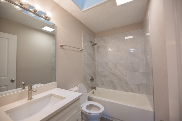 full bathroom with shower / washtub combination, a textured wall, toilet, a textured ceiling, and vanity