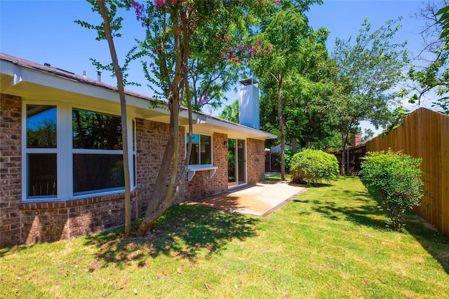 view of yard featuring a fenced backyard and a patio