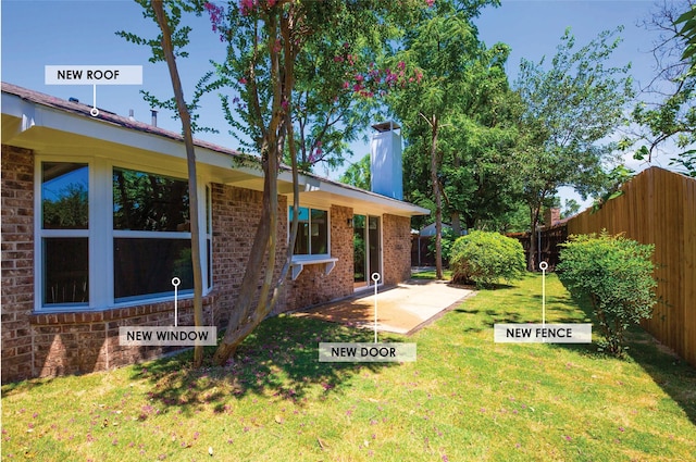 view of yard featuring a patio area and a fenced backyard