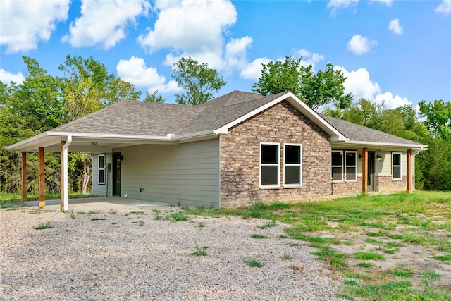 view of front of property with a carport