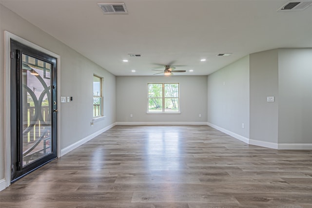 unfurnished room featuring ceiling fan and hardwood / wood-style flooring