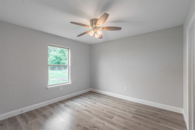 unfurnished room with hardwood / wood-style floors and ceiling fan