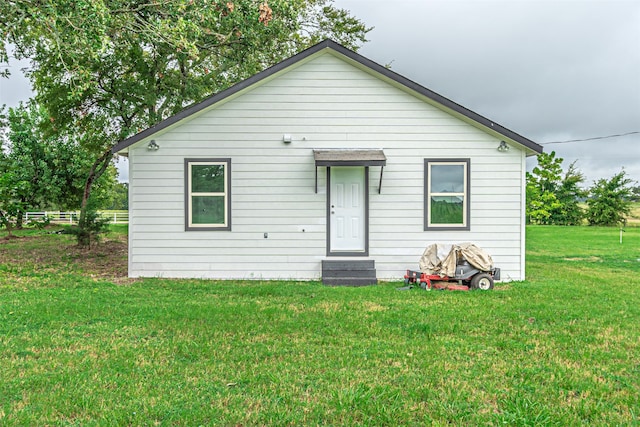 rear view of house with a lawn