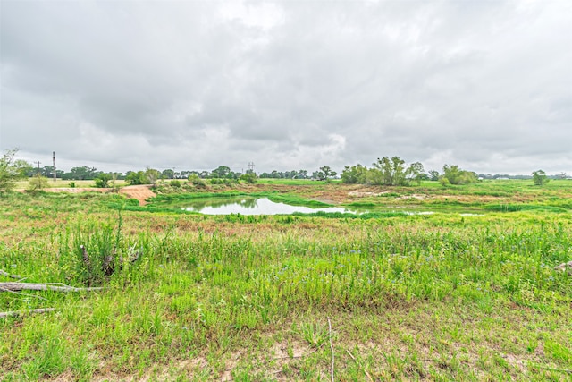 view of local wilderness featuring a water view and a rural view