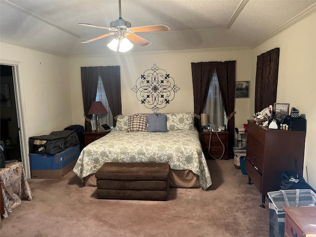 bedroom with carpet flooring, ceiling fan, crown molding, and a textured ceiling