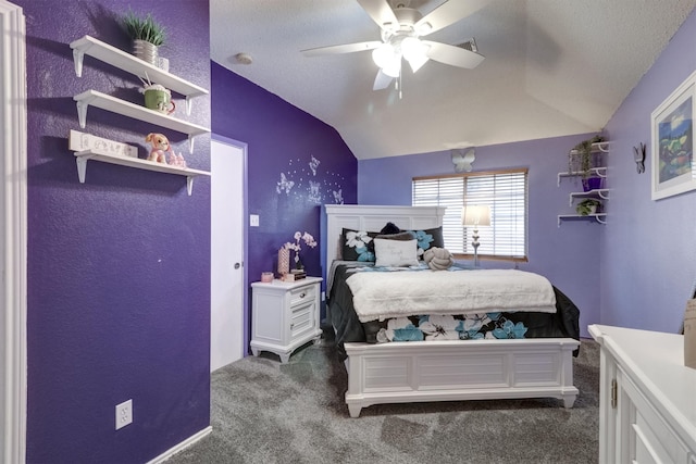 bedroom with lofted ceiling, ceiling fan, carpet, and a textured ceiling