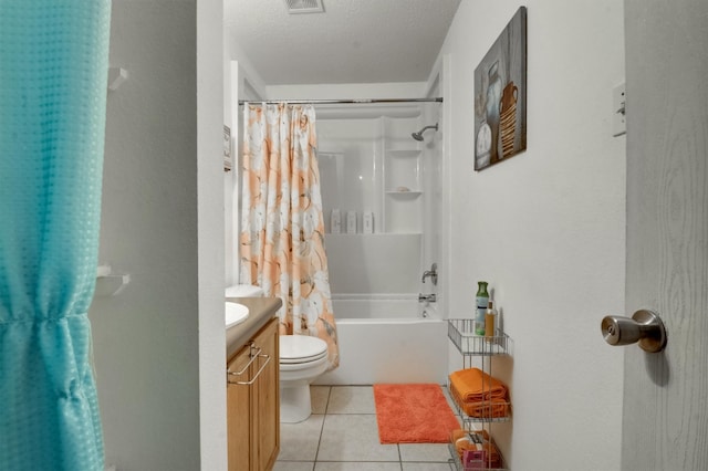 full bathroom with tile patterned flooring, toilet, shower / bath combination with curtain, vanity, and a textured ceiling