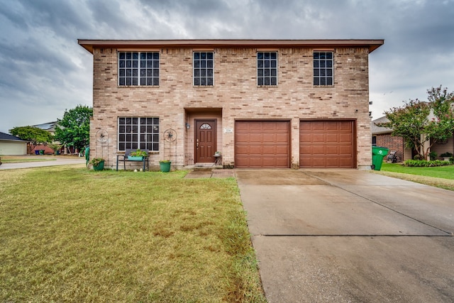 view of front of house with a garage and a front lawn