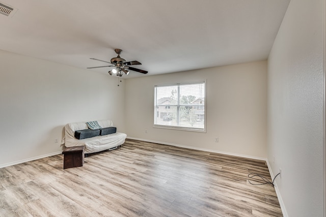 unfurnished room with ceiling fan and light hardwood / wood-style flooring