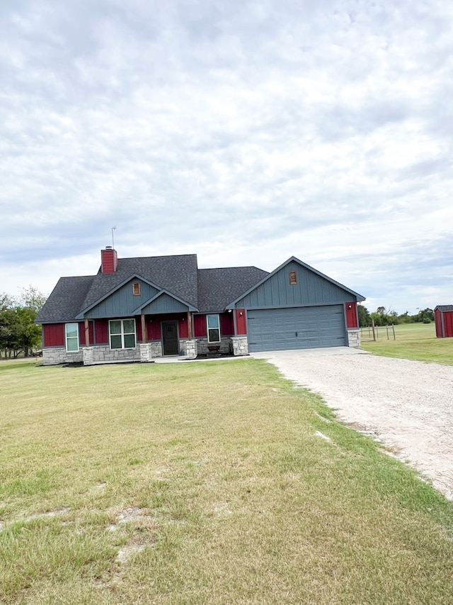 ranch-style house with a garage and a front yard