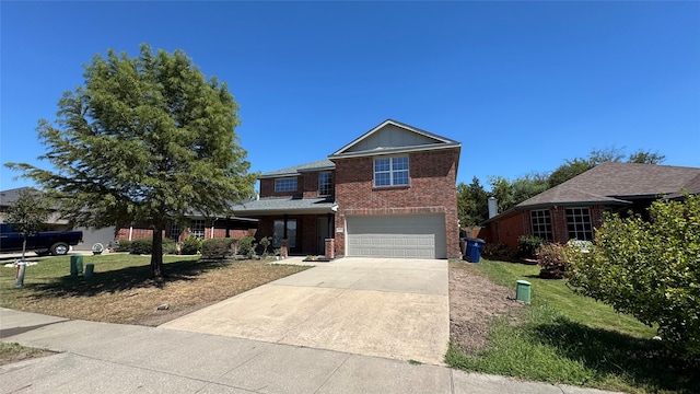 view of front property with a garage and a front yard