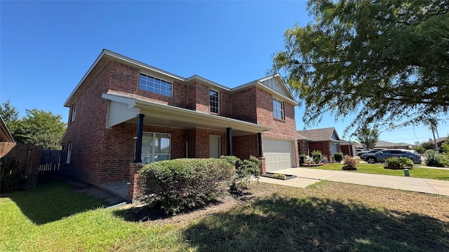 view of front facade with a garage and a front lawn