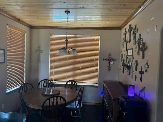 dining area featuring ornamental molding and wooden ceiling