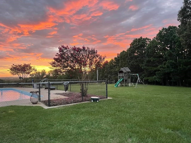 yard at dusk with a playground