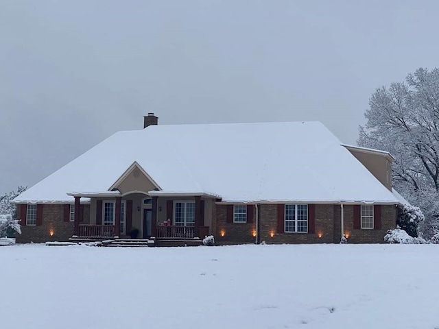 ranch-style house featuring covered porch