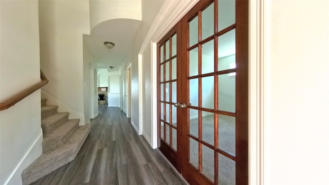 hall with french doors and dark hardwood / wood-style floors