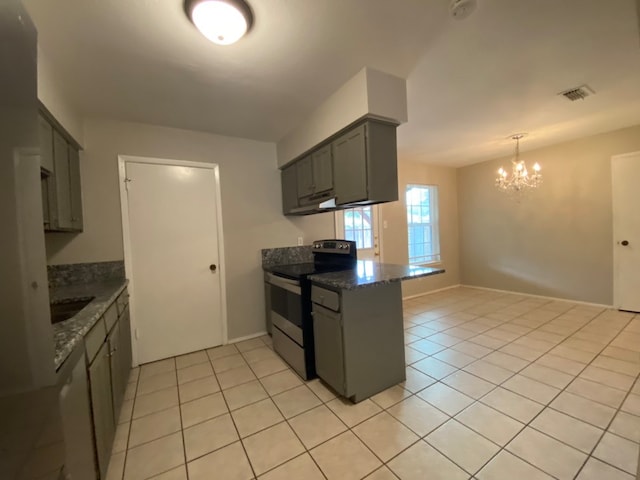 kitchen featuring decorative light fixtures, light tile patterned floors, stainless steel electric range, a chandelier, and dark stone countertops