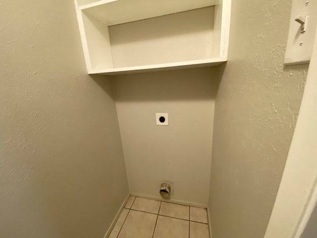 laundry room featuring light tile patterned floors and hookup for an electric dryer