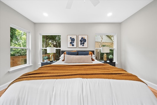 bedroom with hardwood / wood-style floors and ceiling fan