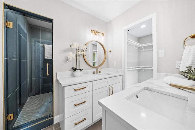 bathroom featuring vanity and tiled shower