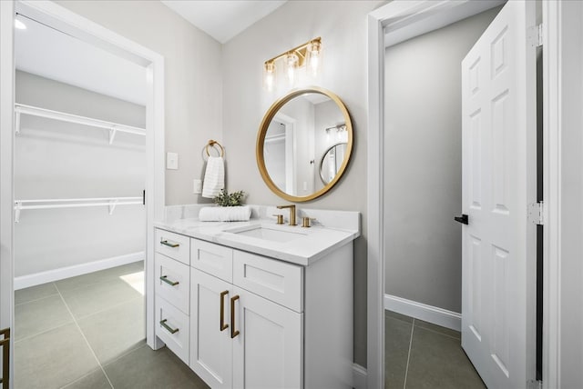 bathroom with tile patterned floors and vanity