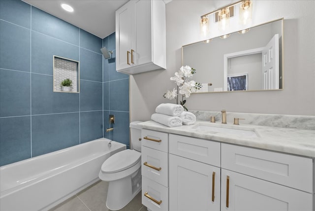 full bathroom with vanity, toilet, tile patterned floors, and tiled shower / bath