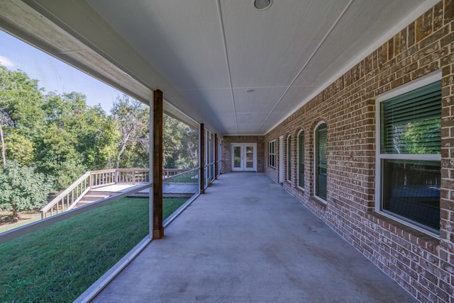 unfurnished sunroom featuring plenty of natural light