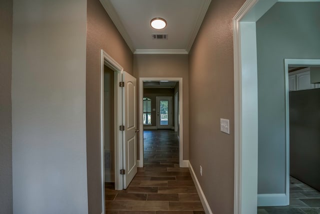 corridor with dark hardwood / wood-style flooring and crown molding