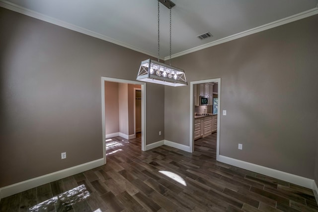 unfurnished dining area with a notable chandelier, dark hardwood / wood-style floors, and crown molding