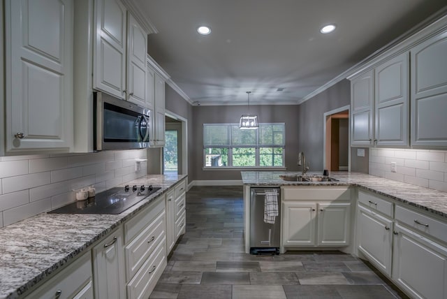 kitchen with white cabinets, sink, black electric cooktop, kitchen peninsula, and decorative backsplash