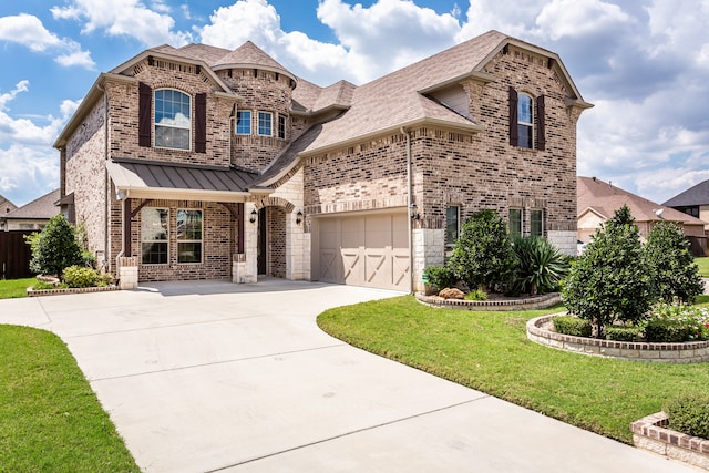 view of front facade with a garage and a front lawn