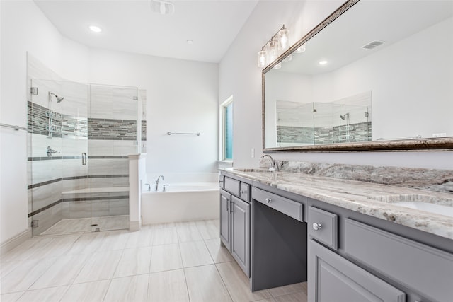 bathroom featuring vanity, tile patterned floors, and shower with separate bathtub