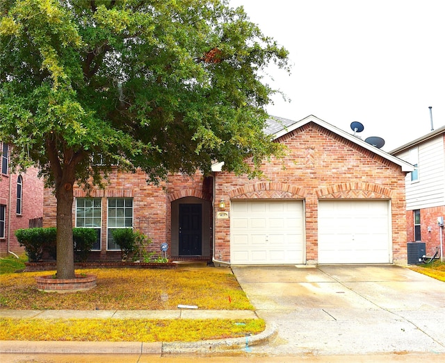 view of front facade with a garage and a front lawn