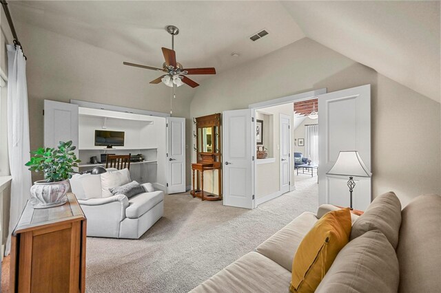 carpeted bedroom featuring vaulted ceiling and ceiling fan