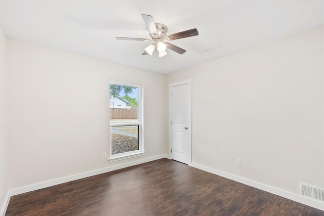 unfurnished room with ceiling fan and dark hardwood / wood-style floors