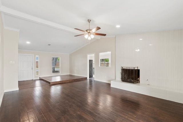 unfurnished living room with vaulted ceiling, plenty of natural light, ceiling fan, and dark hardwood / wood-style floors