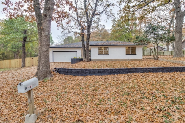 ranch-style house featuring a garage