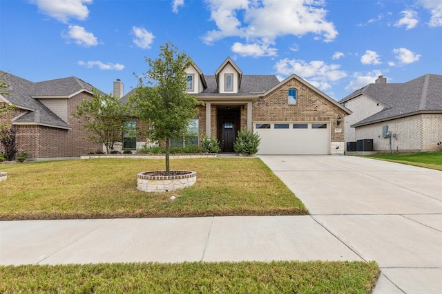 view of front of property with a garage, central air condition unit, and a front lawn