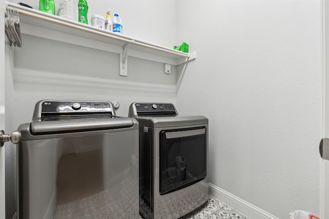 laundry area with washing machine and dryer